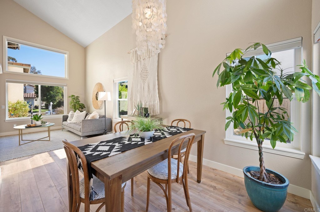 1740 Avenida Segovia Oceanside, CA 92056 - Photo 9 of 40 a living room with furniture a potted plant and a chandelier