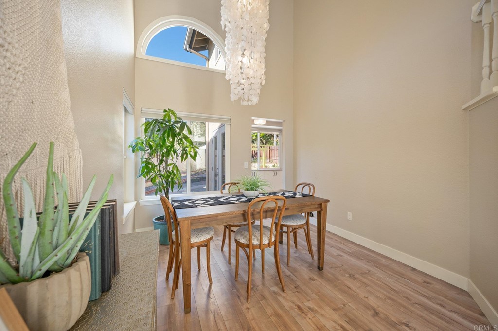 1740 Avenida Segovia Oceanside, CA 92056 - Photo 10 of 40 a view of a dining room with furniture and wooden floor