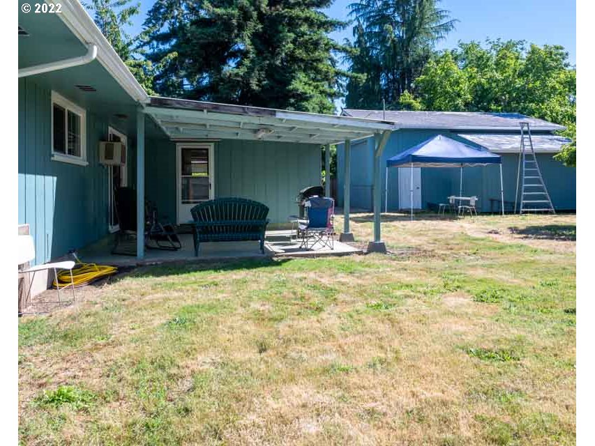 370 Lombard Lane Eugene, OR 97404 - Photo 17 of 19 a backyard of a house with yard and outdoor seating