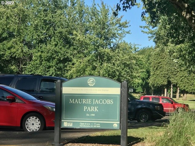 370 Lombard Lane Eugene, OR 97404 - Photo 18 of 19 a view of outdoor space with signage and flags