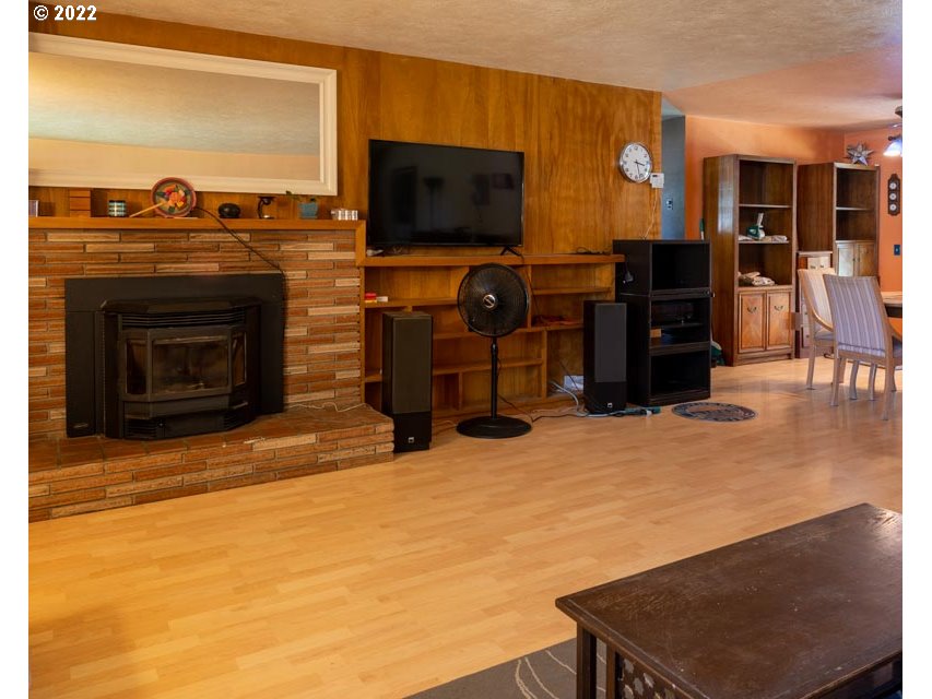 370 Lombard Lane Eugene, OR 97404 - Photo 10 of 19 a living room with fireplace furniture and a flat screen tv