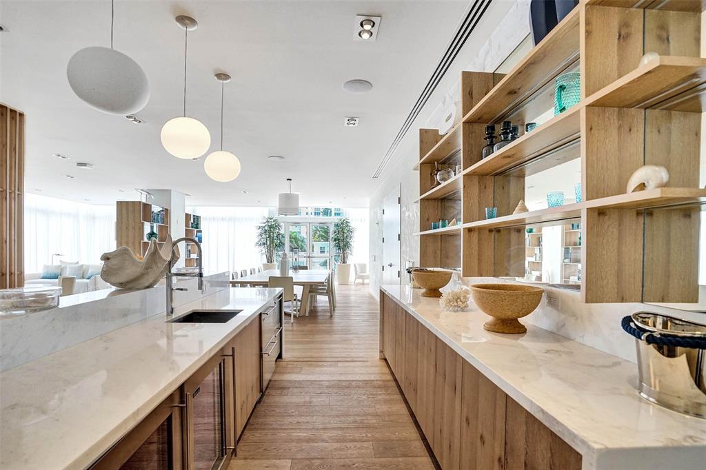 401 North Birch Road, Unit 1212 Fort Lauderdale, FL 33304 - Photo 26 of 40 a kitchen with counter top space and living room