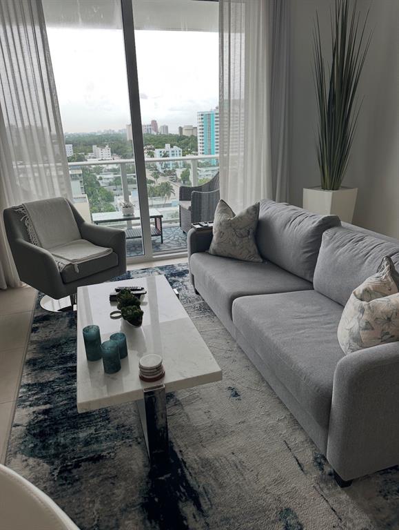 401 North Birch Road, Unit 1212 Fort Lauderdale, FL 33304 - Photo 6 of 40 a living room with furniture and a large window