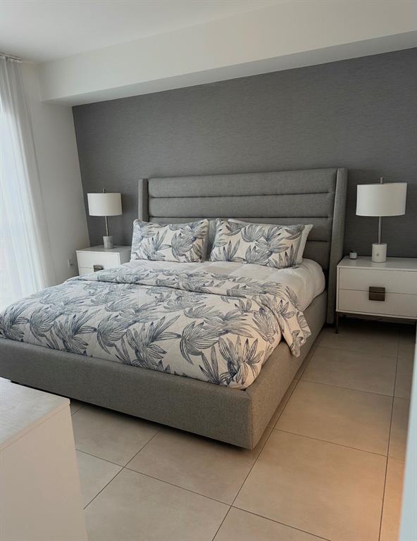 401 North Birch Road, Unit 1212 Fort Lauderdale, FL 33304 - Photo 8 of 40 a bedroom with a bed and window