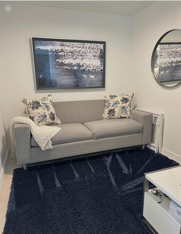 401 North Birch Road, Unit 1212 Fort Lauderdale, FL 33304 - Photo 9 of 40 a living room with furniture and a fireplace