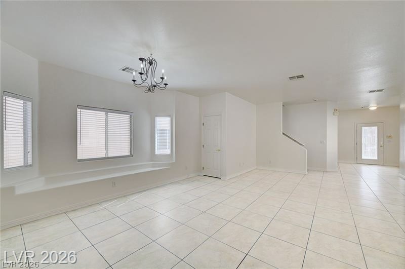 8918 Houston Ridge Avenue Las Vegas, NV 89178 - Photo 6 of 47 Unfurnished room with light tile patterned floors and suspended lighting