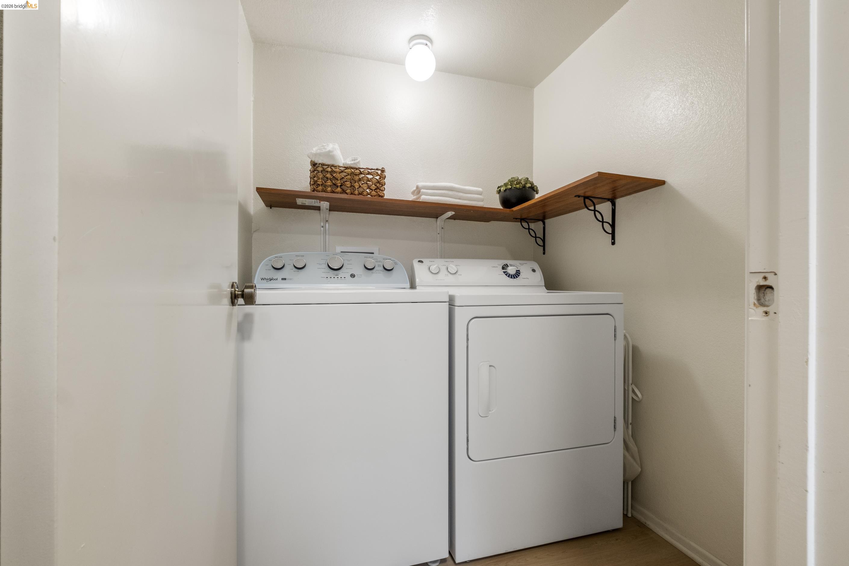 214 Apollo, Unit 3 Hercules, CA 94547 - Photo 18 of 26 Laundry area featuring washer and dryer and baseboards