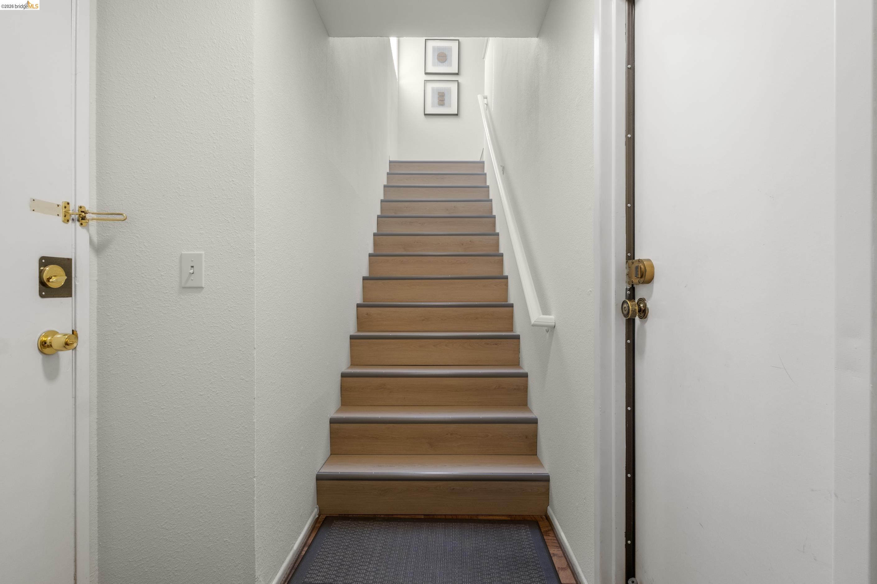 214 Apollo, Unit 3 Hercules, CA 94547 - Photo 19 of 26 Stairs with a textured wall and baseboards