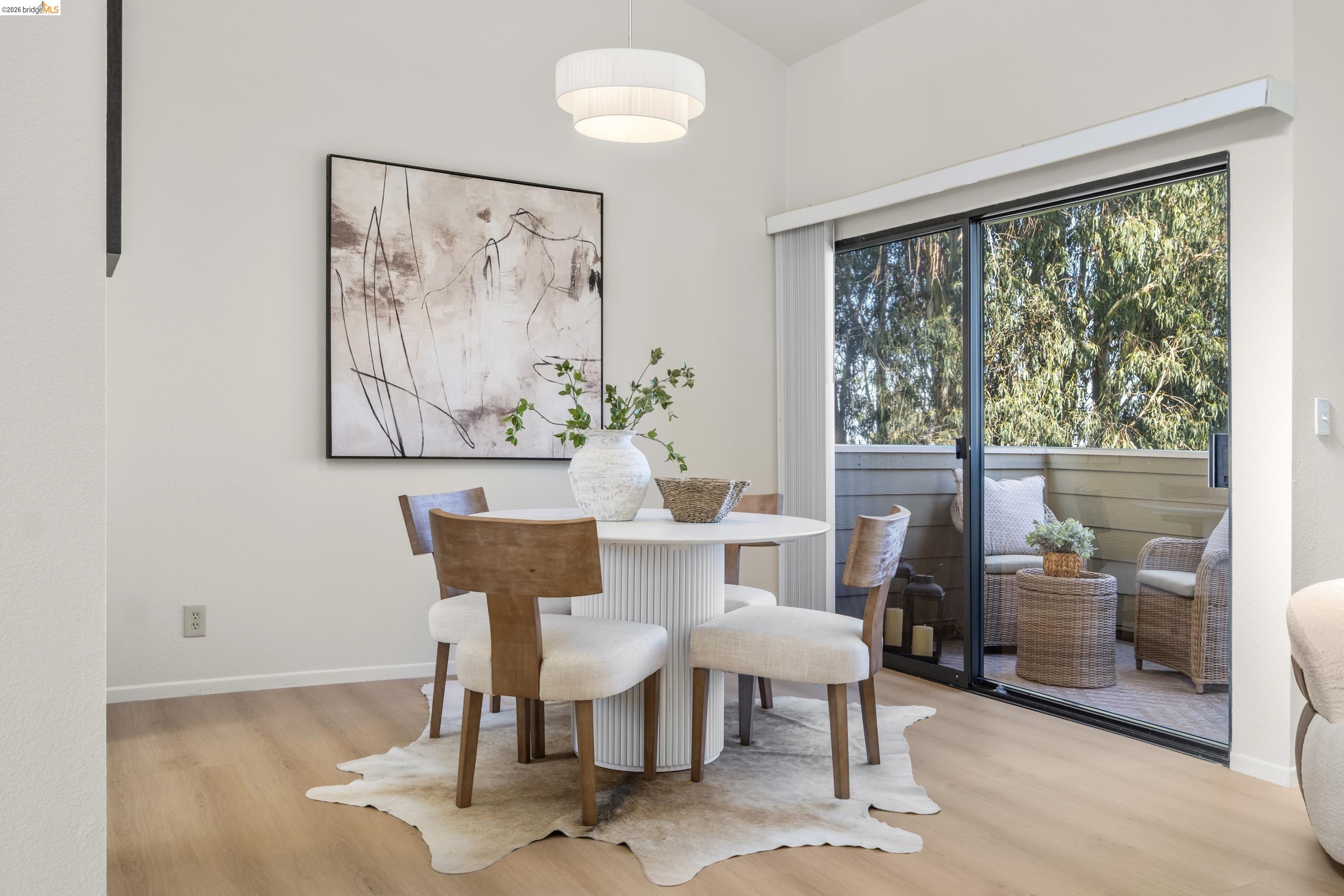 214 Apollo, Unit 3 Hercules, CA 94547 - Photo 2 of 26 Dining area with light wood-style flooring and baseboards