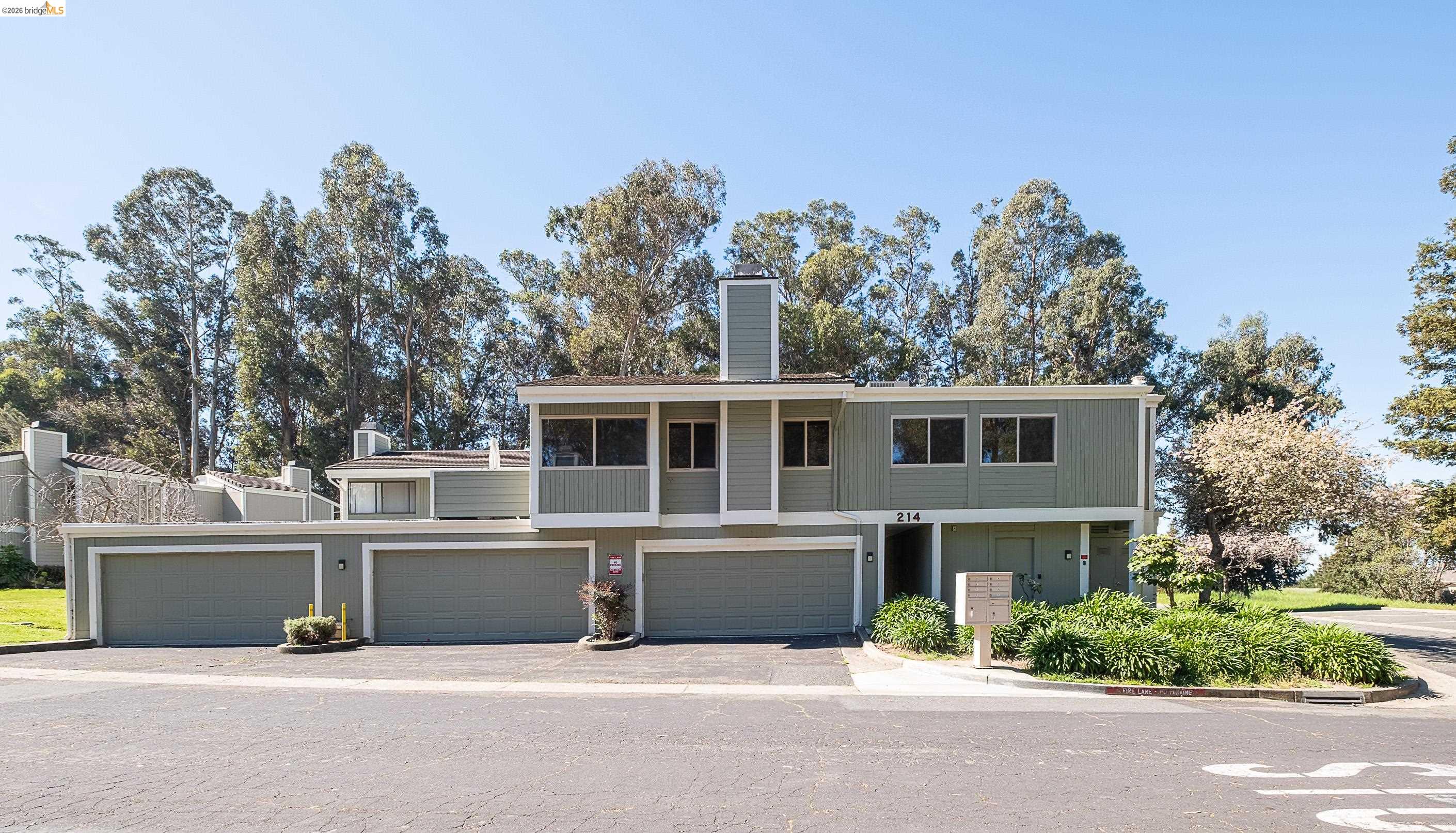 214 Apollo, Unit 3 Hercules, CA 94547 - Photo 23 of 26 View of front of house featuring a chimney and a garage