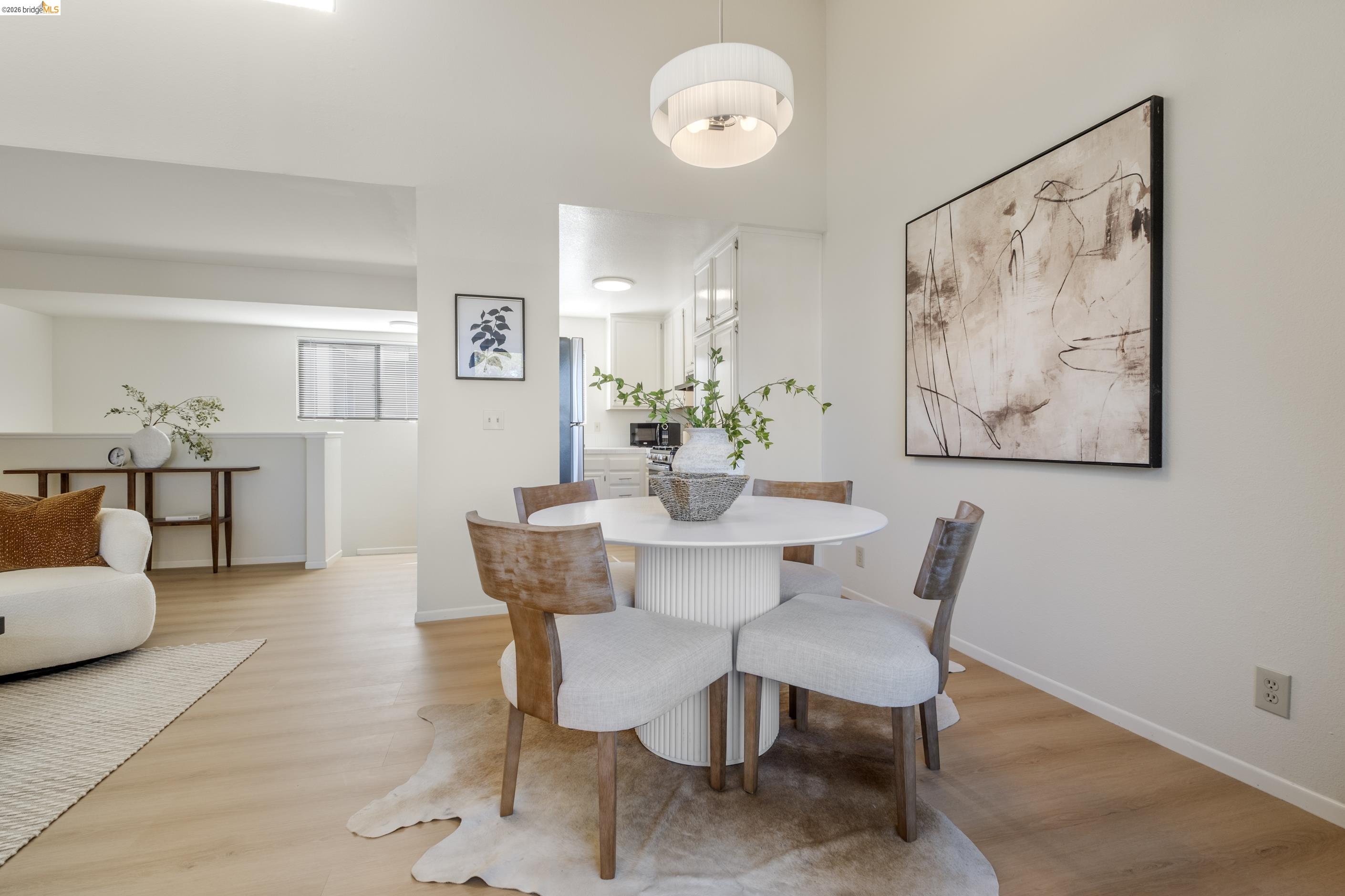 214 Apollo, Unit 3 Hercules, CA 94547 - Photo 5 of 26 Dining room with light wood-style floors and baseboards