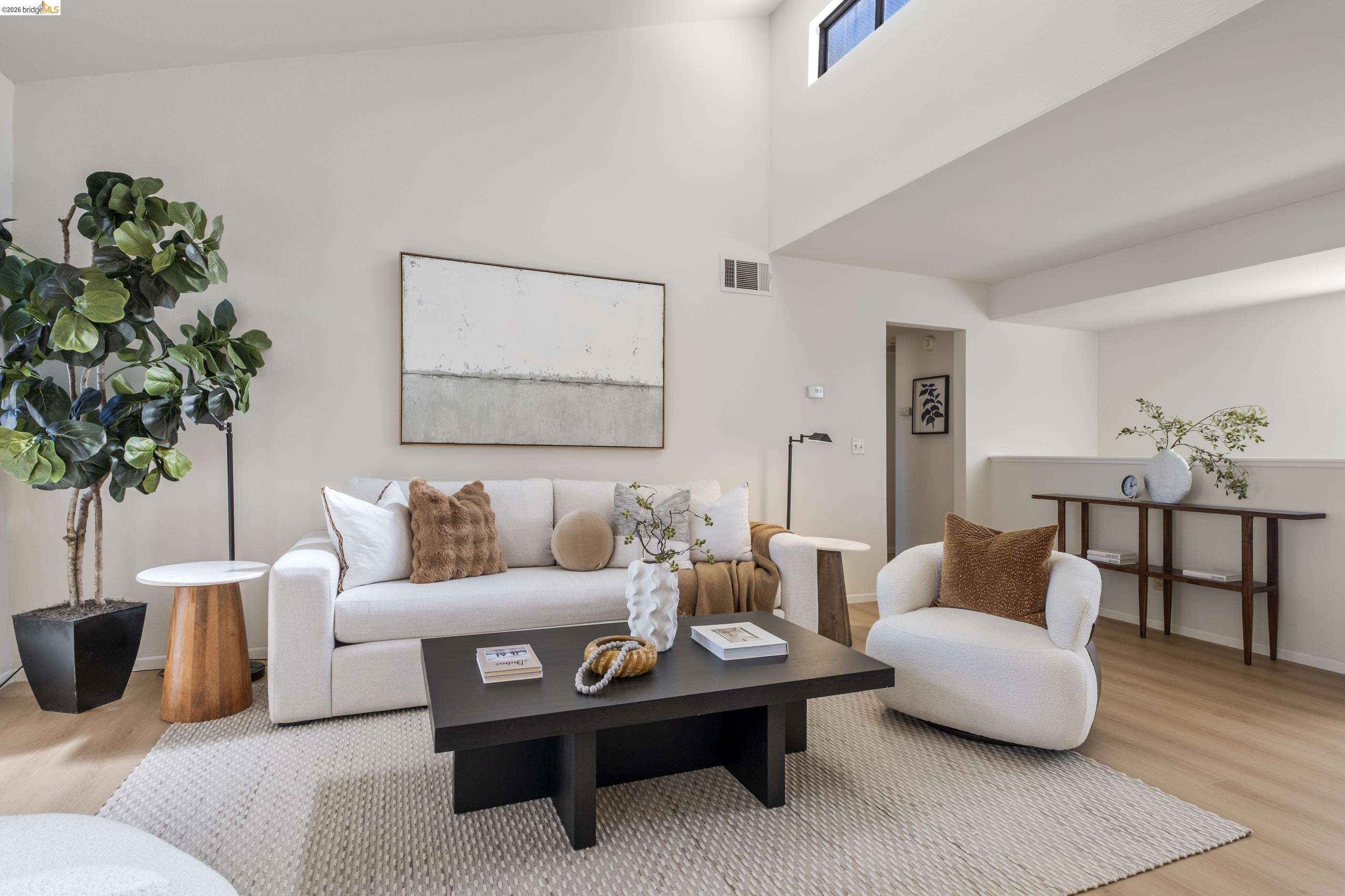 214 Apollo, Unit 3 Hercules, CA 94547 - Photo 10 of 26 Living area featuring light wood-type flooring and a high ceiling