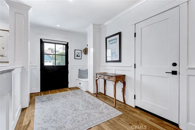 a view of a dining room with furniture and a potted plant