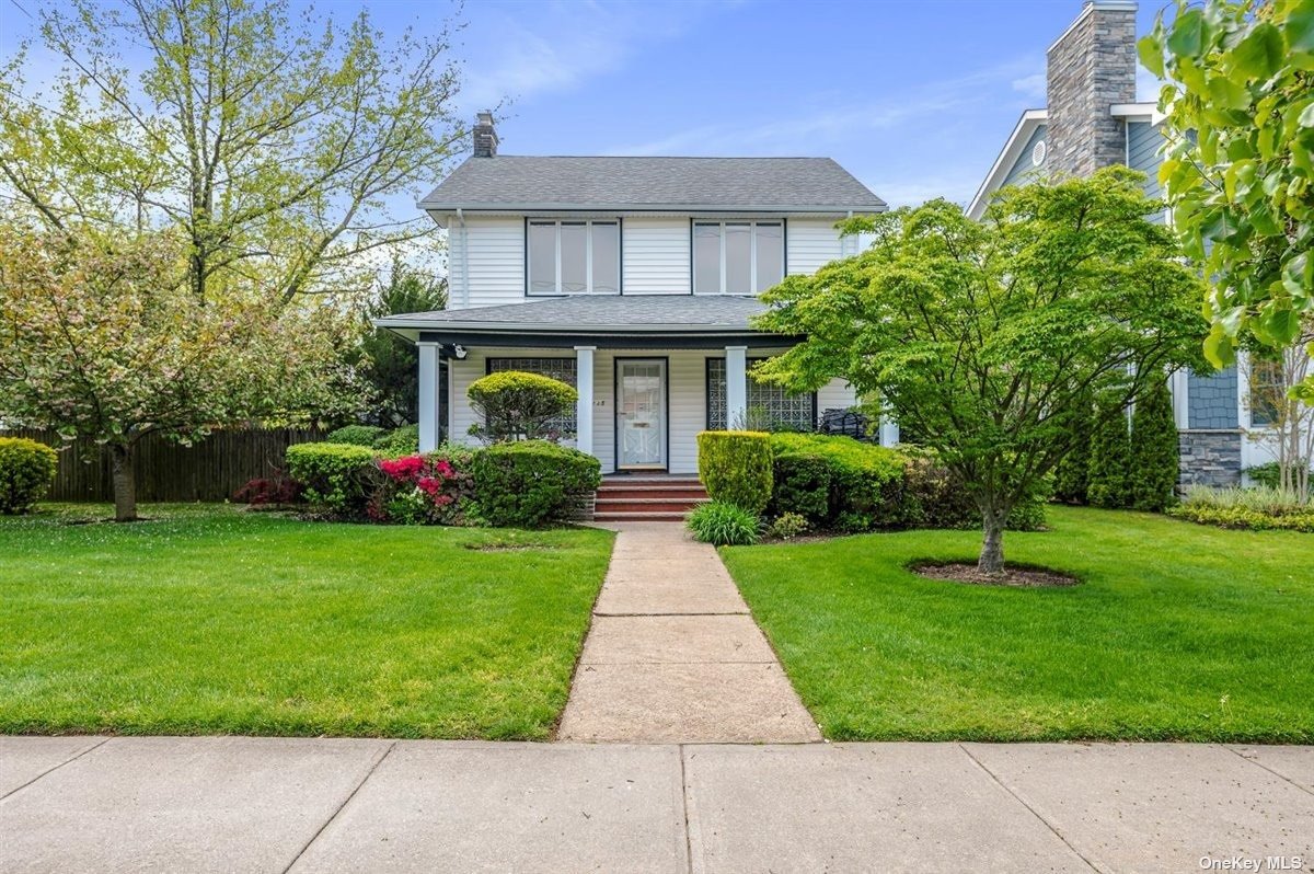 a front view of house with yard