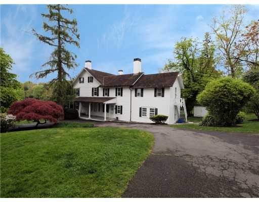 146 Goodwives River Road Darien, CT 06820 - Photo 4 of 13 a view of a house with a garden
