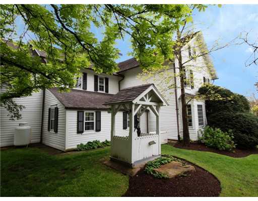 146 Goodwives River Road Darien, CT 06820 - Photo 5 of 13 a front view of a house with a garden