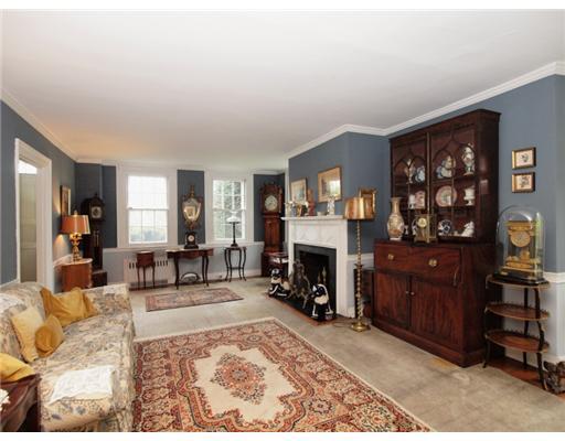 146 Goodwives River Road Darien, CT 06820 - Photo 9 of 13 a living room with furniture a fireplace and a window