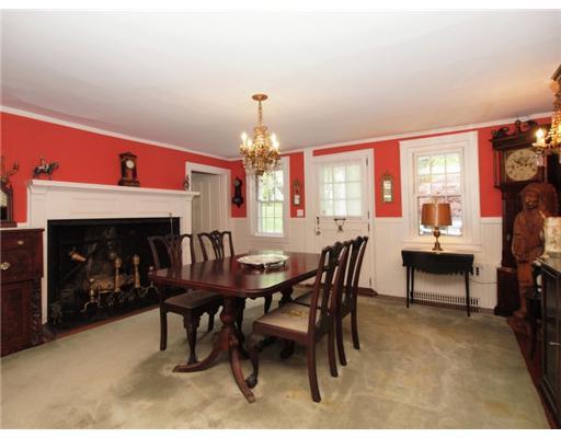 146 Goodwives River Road Darien, CT 06820 - Photo 10 of 13 a view of a dining room with furniture and chandelier