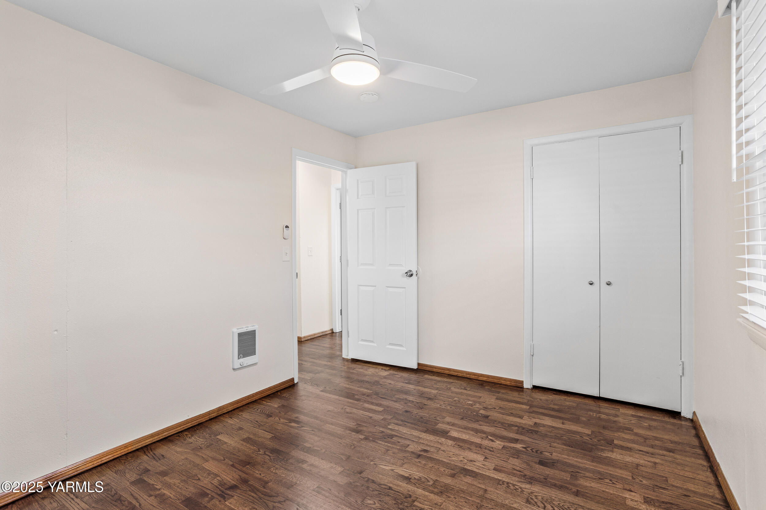 814 Adams Avenue Toppenish, WA 98948 - Photo 6 of 23 a view of an empty room with wooden floor