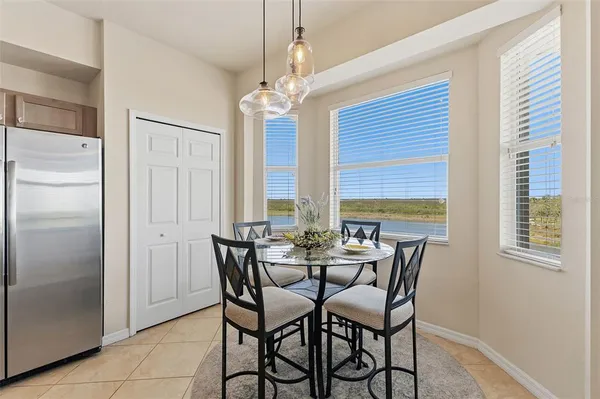 a view of a dining room with furniture window and outside view