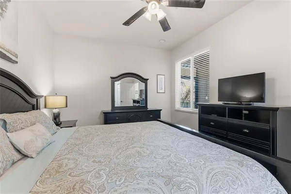 a bedroom with a bed and lamps