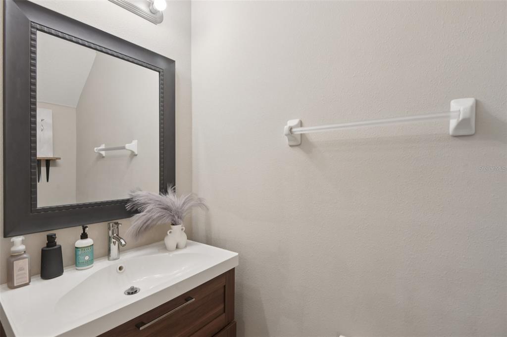 7046 Towne Lake Road Riverview, FL 33578 - Photo 19 of 47 a bathroom with a sink and a mirror