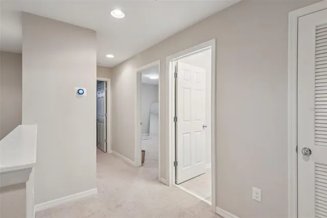 a view of a hallway with closet area