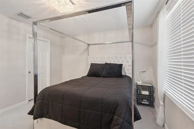 a bedroom with a bed and a closet