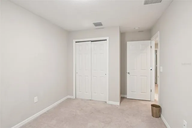 an empty room with closet area