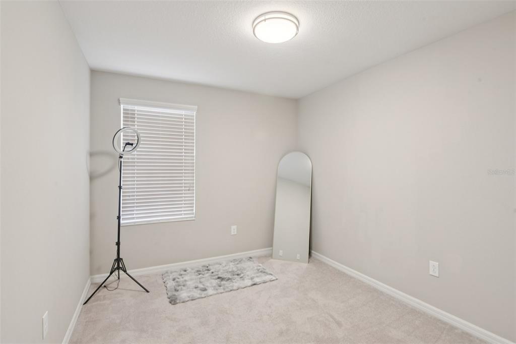 7046 Towne Lake Road Riverview, FL 33578 - Photo 28 of 47 an empty room with windows