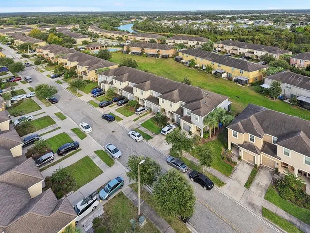 an aerial view of residential houses with outdoor space