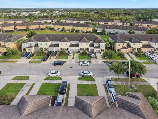 an aerial view of a house with a garden