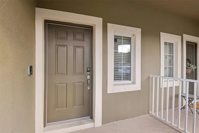 a view of a hallway that has a door in front of it