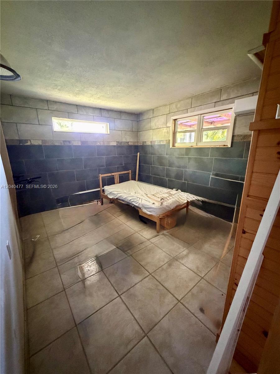 9110 Southwest 44th Street Miami, FL 33165 - Photo 11 of 18 a bathroom with a sink and shower