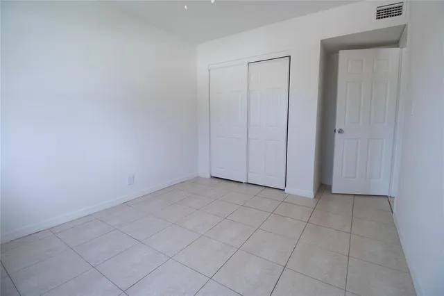 an empty room with white door