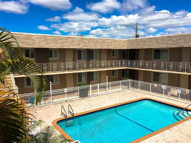 a view of a balcony with a floor to ceiling window