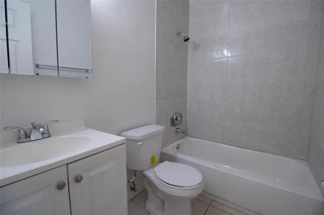 a bathroom with a sink toilet and bathtub