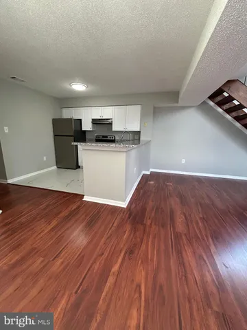 a view of a kitchen with a sink and a microwave