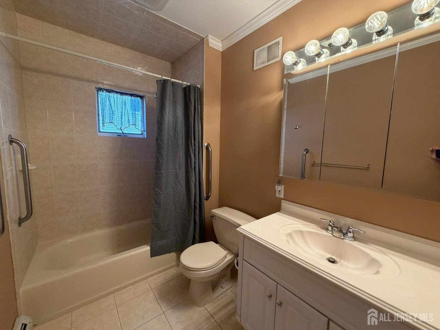 628 Grove Avenue Edison, NJ 08820 - Photo 11 of 21 a bathroom with a sink a toilet and shower