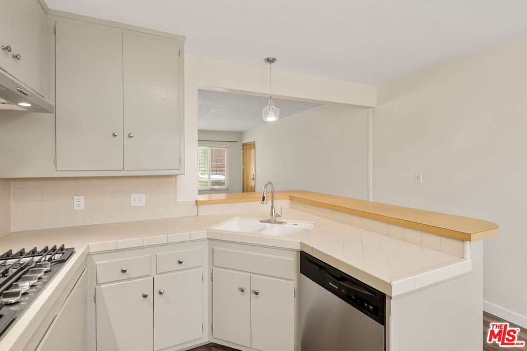 8335 West Manchester Avenue, Unit D Playa del Rey, CA 90293 - Photo 11 of 17 a utility room with cabinets