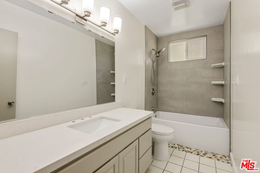 8335 West Manchester Avenue, Unit D Playa del Rey, CA 90293 - Photo 12 of 17 a bathroom with a sink a toilet and shower