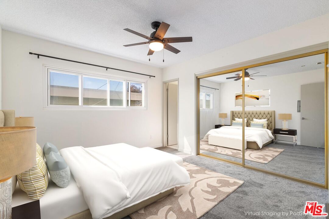 8335 West Manchester Avenue, Unit D Playa del Rey, CA 90293 - Photo 13 of 17 a bedroom with a bed and window