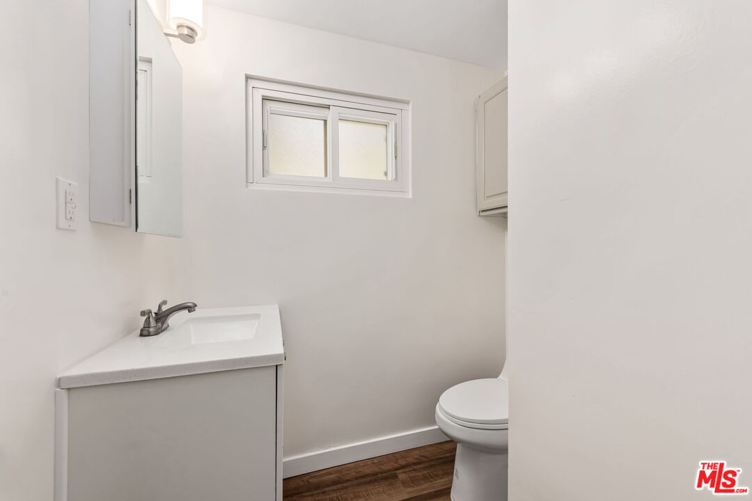 8335 West Manchester Avenue, Unit D Playa del Rey, CA 90293 - Photo 16 of 17 a bathroom with a sink toilet and a mirror