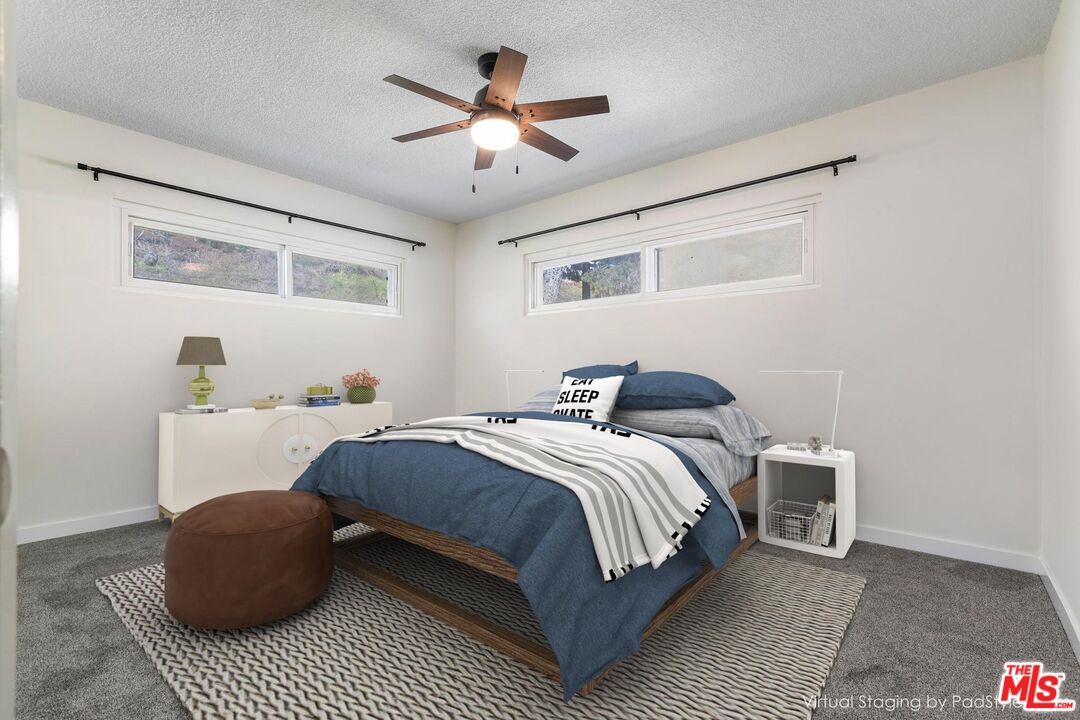 8335 West Manchester Avenue, Unit D Playa del Rey, CA 90293 - Photo 17 of 17 a bedroom with a bed couch and window