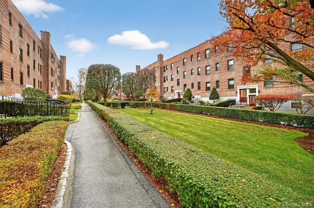 a view of a building with a yard