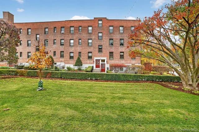a view of a building with a yard