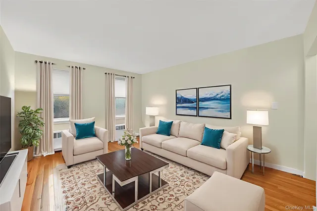 a living room with furniture and a lamp