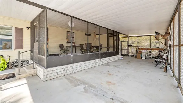 a view of a patio with chairs and tables