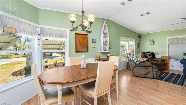 a dining room with furniture and window