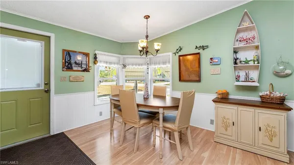 a living room with furniture ceiling fan and a window